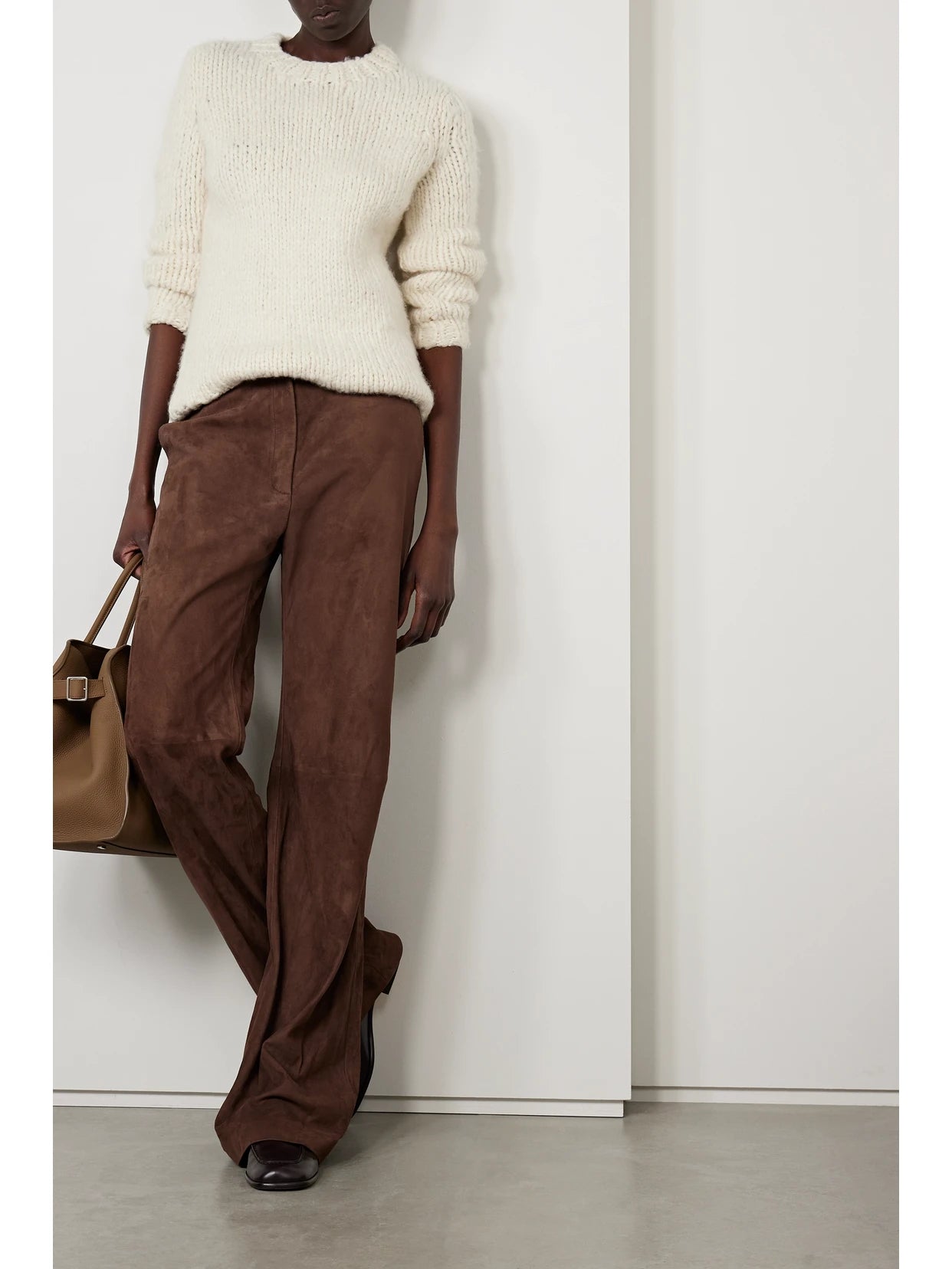 Image of a model wearing Outerwear. Product name - Lawrence Cashmere Sweater in Ivory colour by brand - Gabriela Hearst