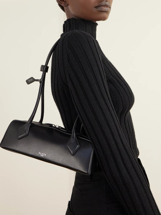 Image of Bags. Product name - Le Teckel Small Leather Shoulder Bag in Black colour by brand - Alaïa