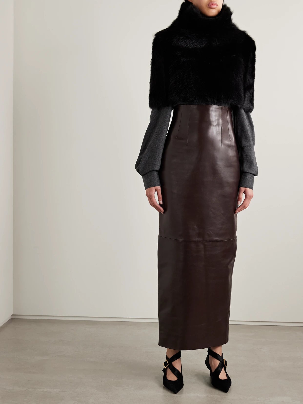 Image of a model wearing Skirts. Product name - Loxley Leather Maxi Skirt in Dark brown colour by brand - KHAITE