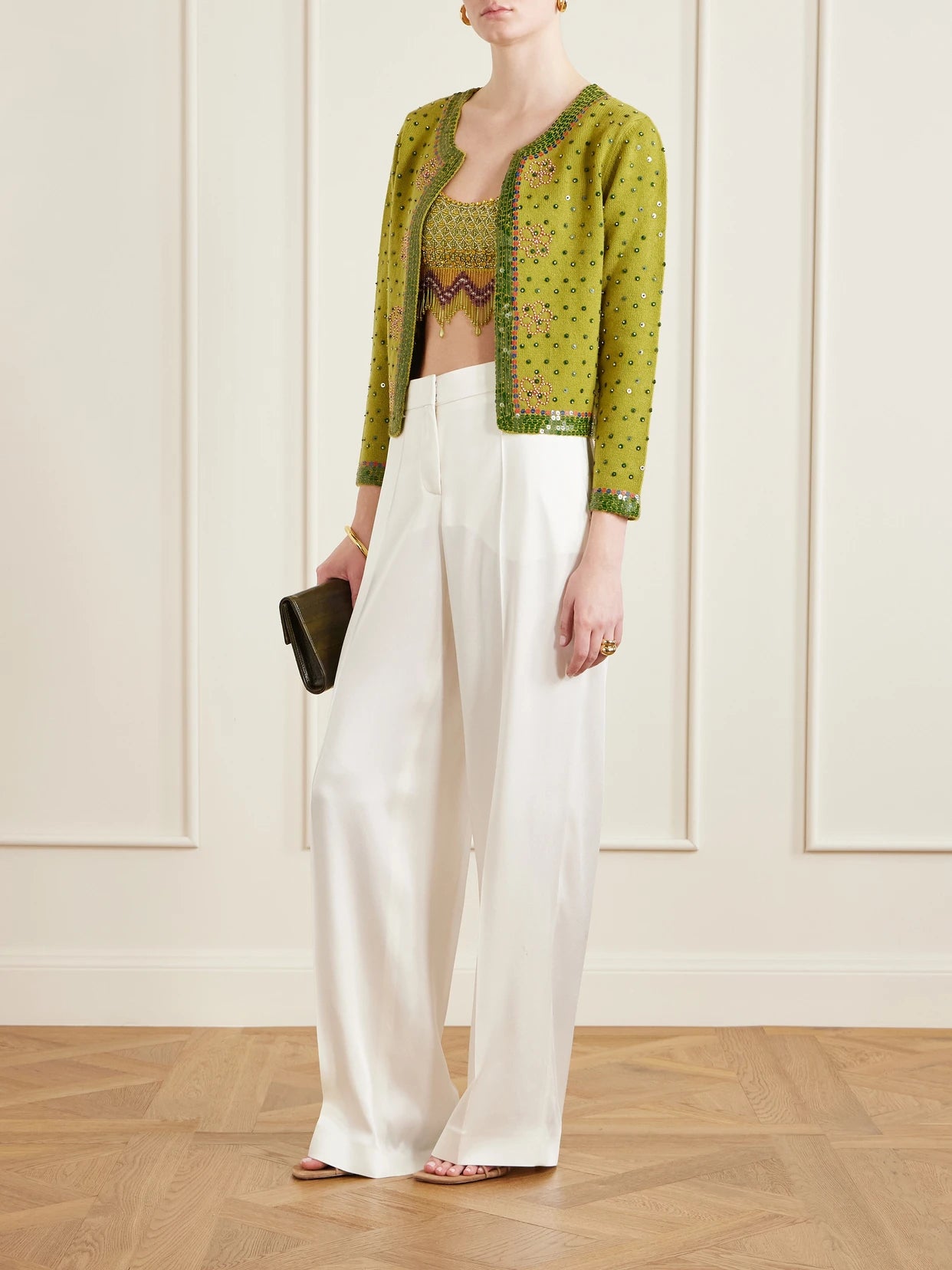 Image of a model wearing Tops. Product name - Bottleglass Cropped Fringed Beaded Satin Top in Lime green colour by brand - BODE