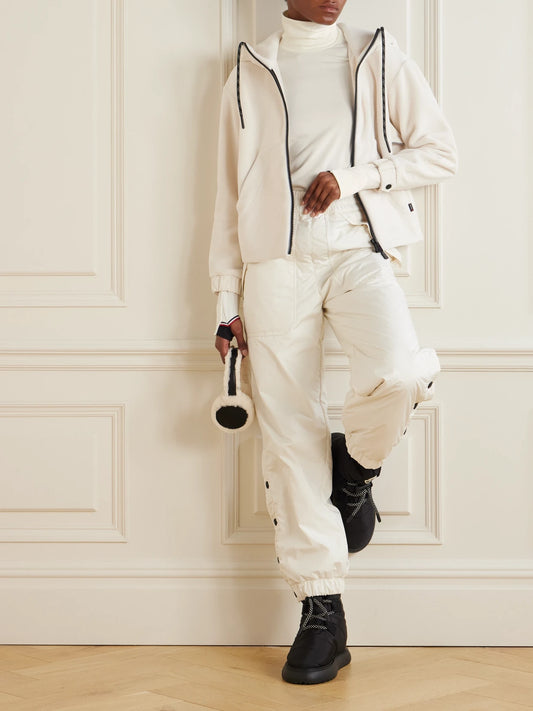 Image of a model wearing Tops. Product name - Polartec Stretch-knit Turtleneck Base Layer in Cream colour by brand - Moncler Grenoble