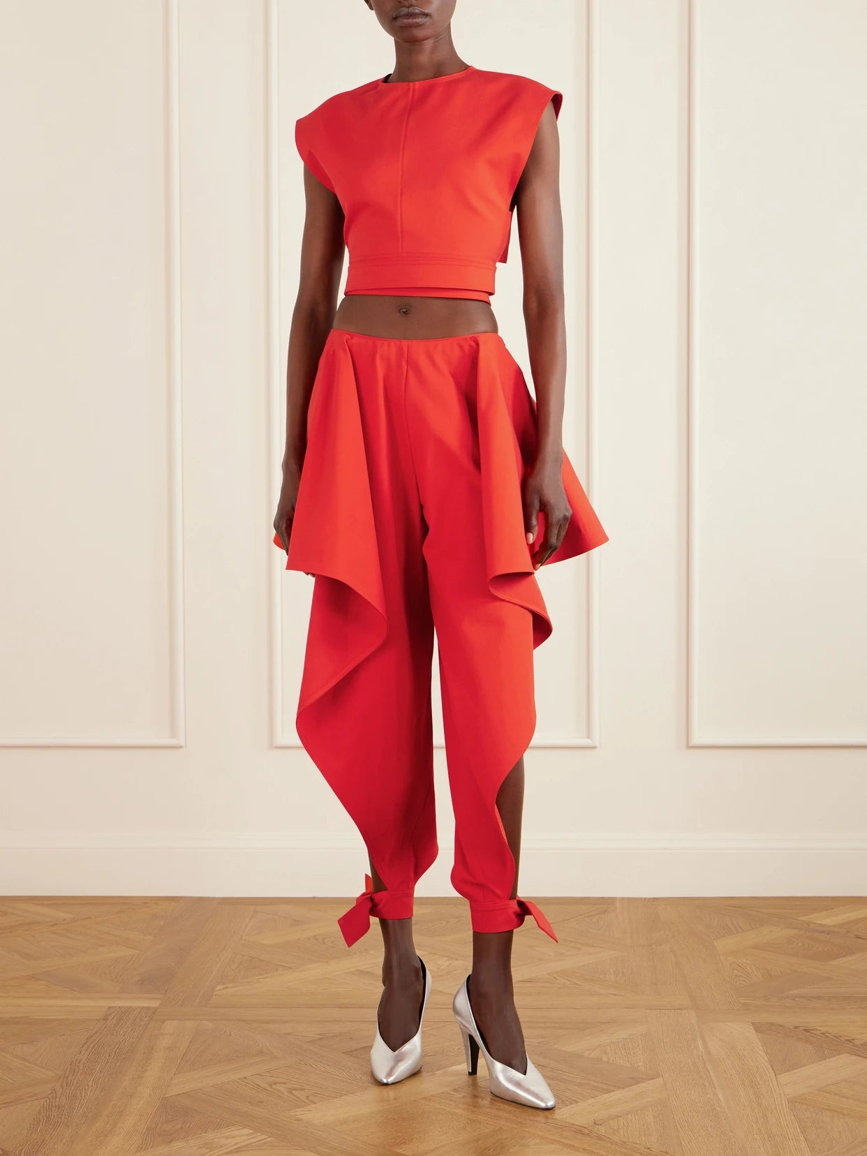 Image of a model wearing Tops. Product name - Cropped Cotton-poplin Top in Red colour by brand - Alaïa