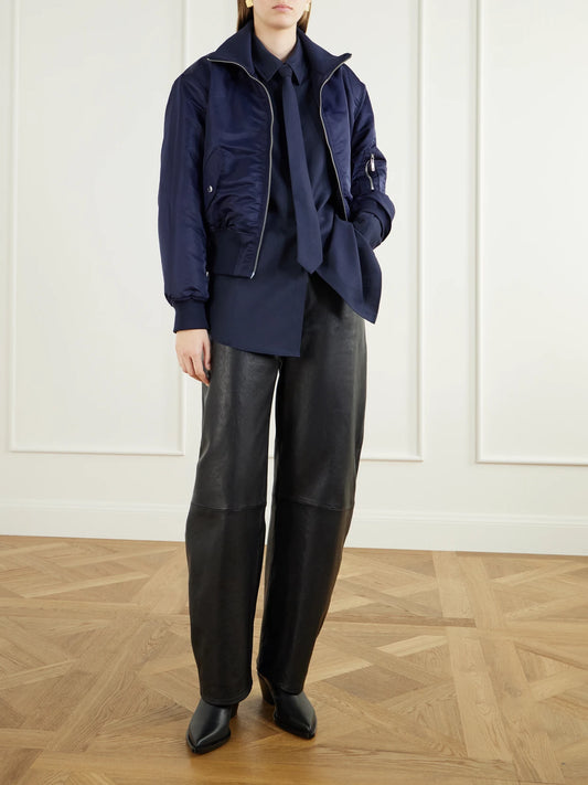 Image of a model wearing Tops. Product name - Peri Tie-detailed Oversized Georgette Shirt in Navy colour by brand - The Frankie Shop