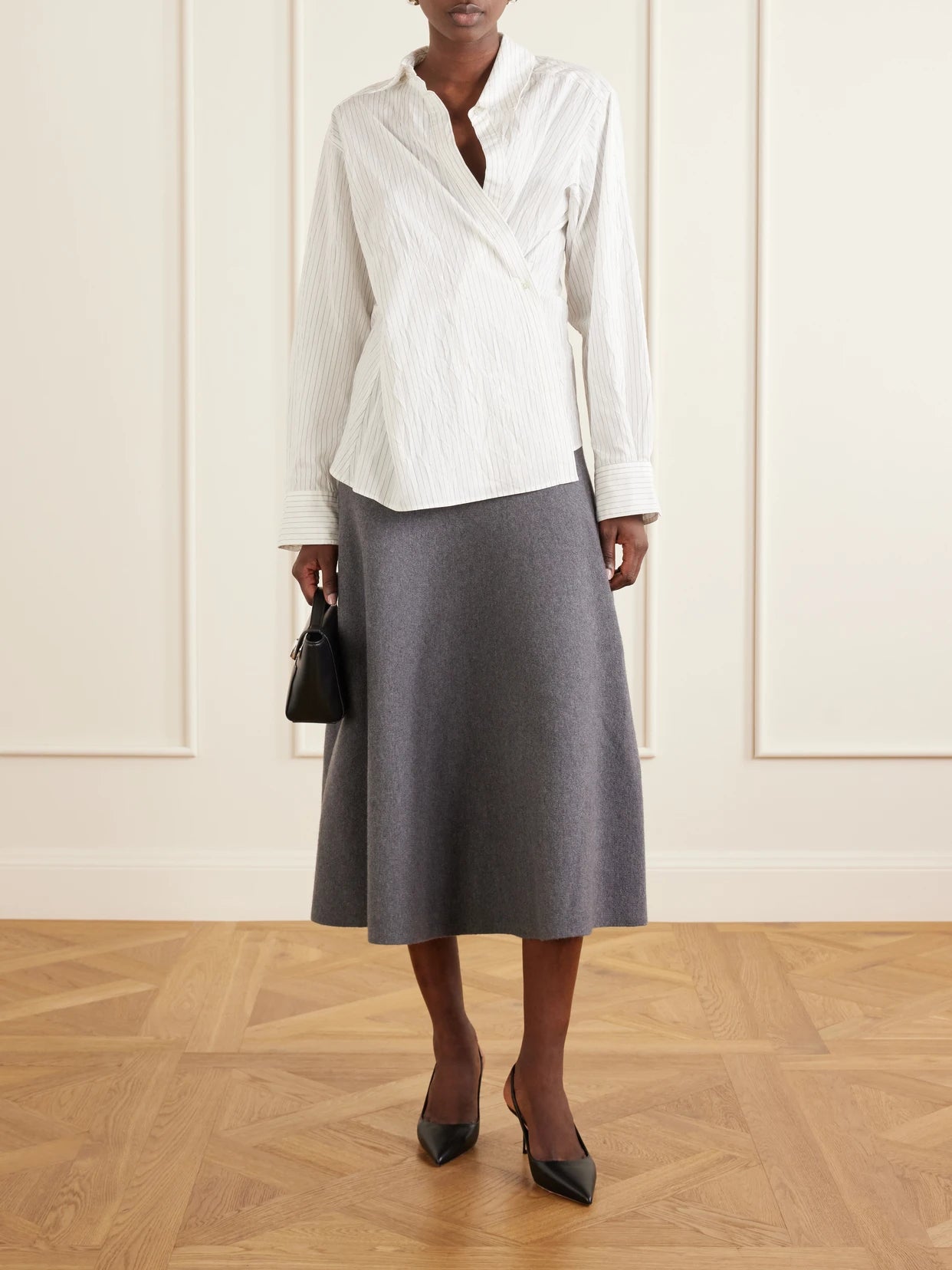 Image of a model wearing Skirts. Product name - The Miller Wool-felt Midi Skirt in Gray colour by brand - Brandon Maxwell