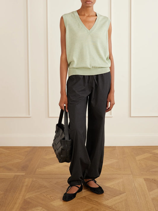 Image of a model wearing Pants. Product name - Petri Cotton-poplin Balloon Trousers in Black colour by brand - SKALL
