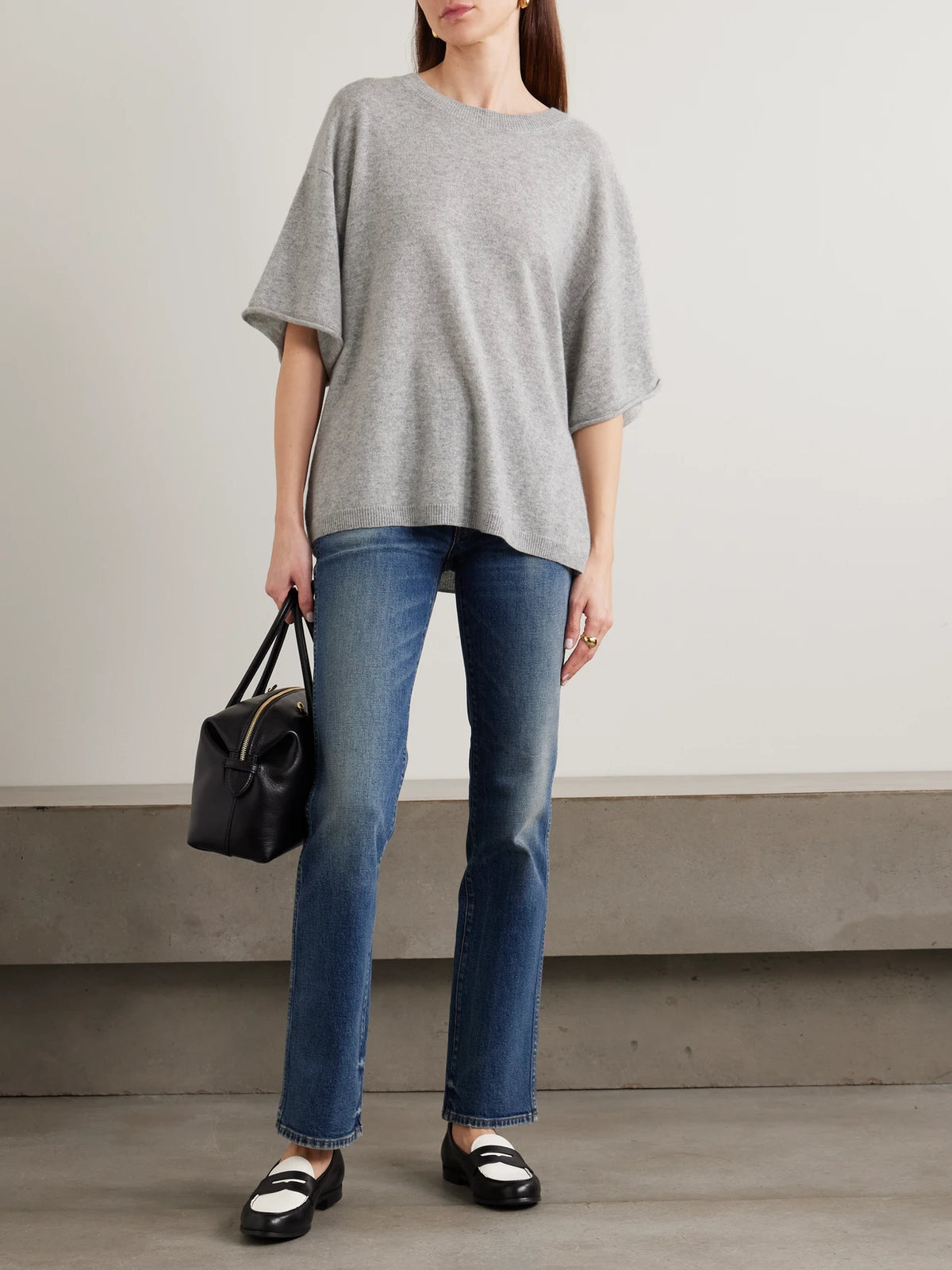 Image of a model wearing Outerwear. Product name - Cashmere T-shirt in Off-white colour by brand - Jamie Haller