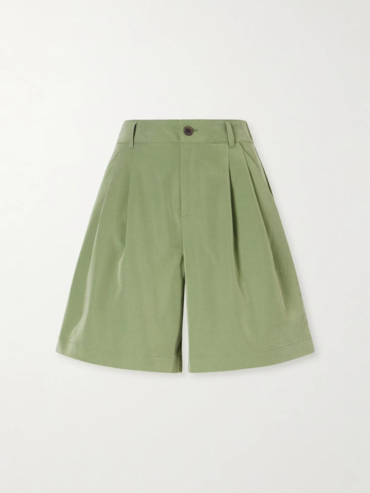 Image of a model wearing Shorts. Product name - Phelan Twill Shorts in Green colour by brand - Varley