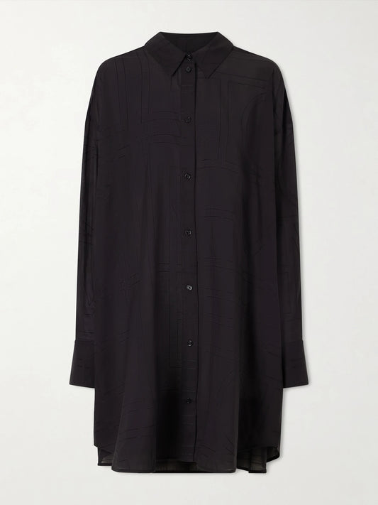 Image of a model wearing Tops. Product name - Organic Cotton And Lyocell-blend Shirt in Black colour by brand - TOTEME