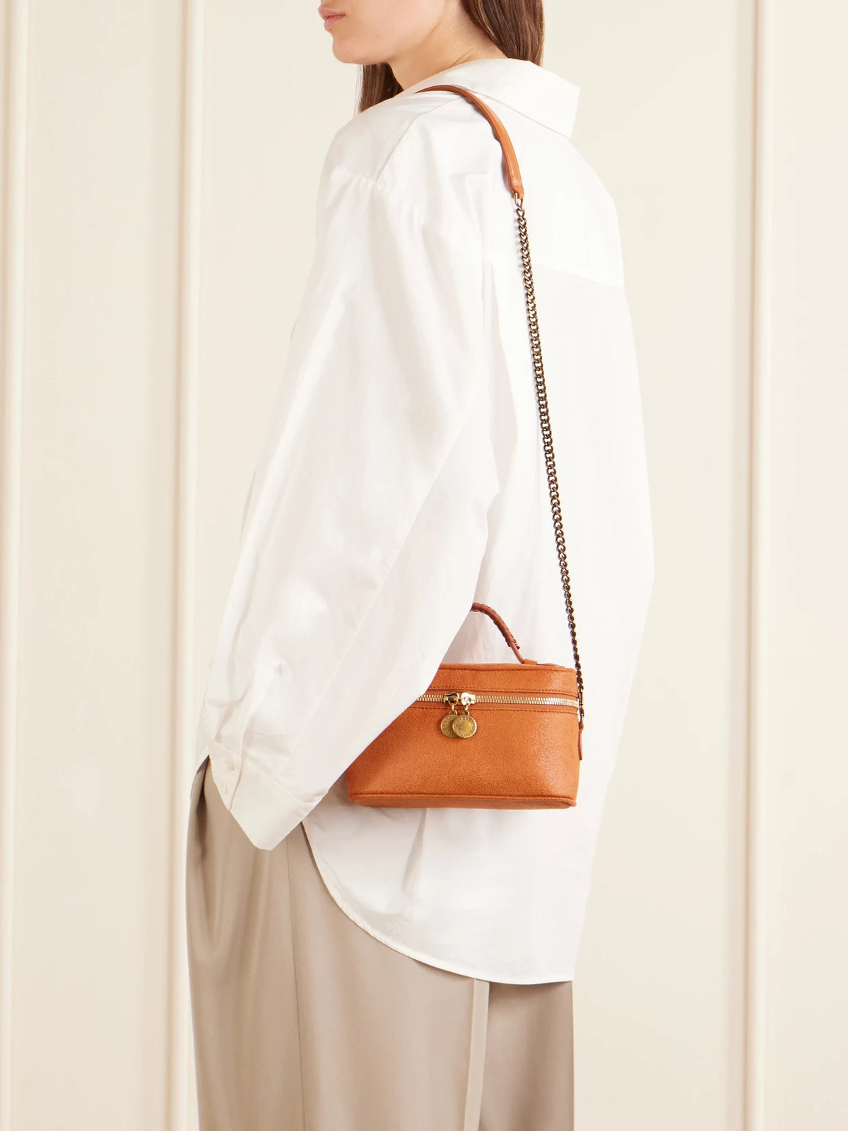 Image of Bags. Product name - Falabella Vanity Metallic Vegetarian Leather Shoulder Bag in Orange colour by brand - Stella McCartney