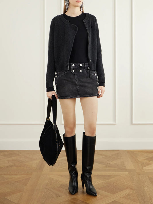 Image of a model wearing Skirts. Product name - Ralma Button-detailed Denim Mini Skirt in Black colour by brand - ISABEL MARANT