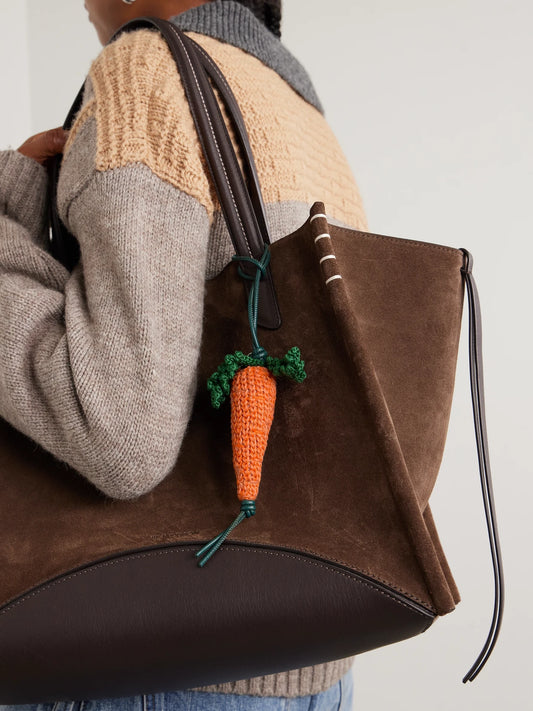 Image of Keychains. Product name - Carrot Crocheted Cotton And Leather Bag Charm in Orange colour by brand - JW Anderson