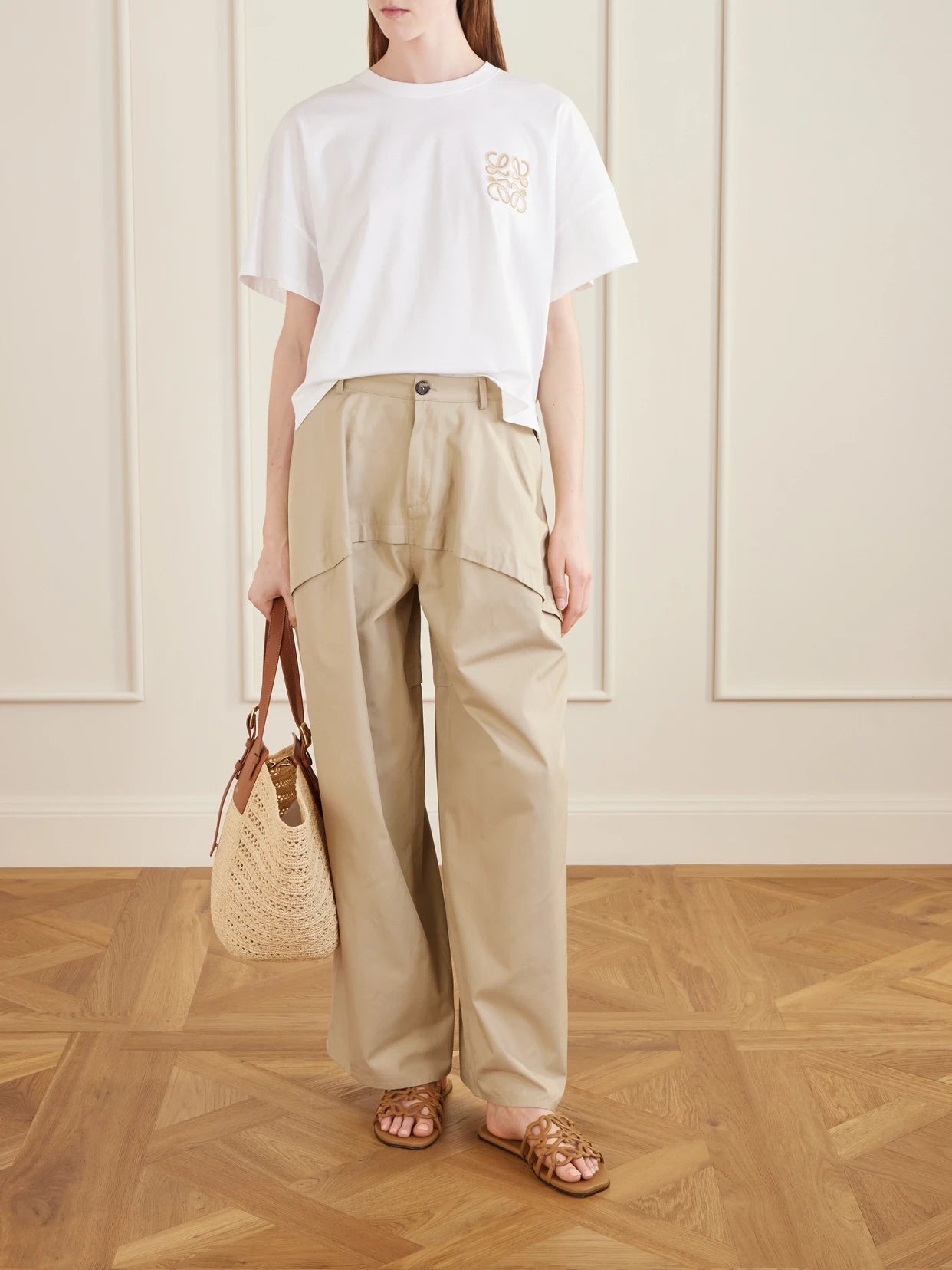 Image of a model wearing Pants. Product name - + Paula's Ibiza Paneled Cotton Gabardine Wide-leg Pants in Beige colour by brand - LOEWE