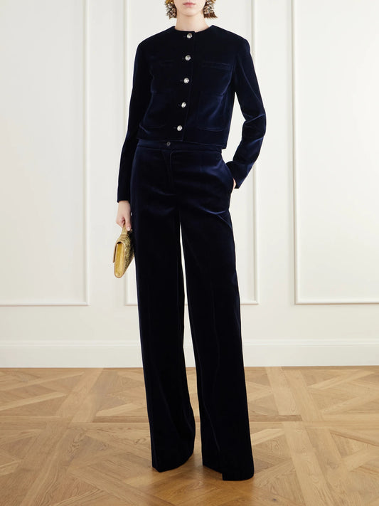 Image of a model wearing Pants. Product name - Rudy Cotton-blend Velvet Straight-leg Pants in Navy colour by brand - Altuzarra