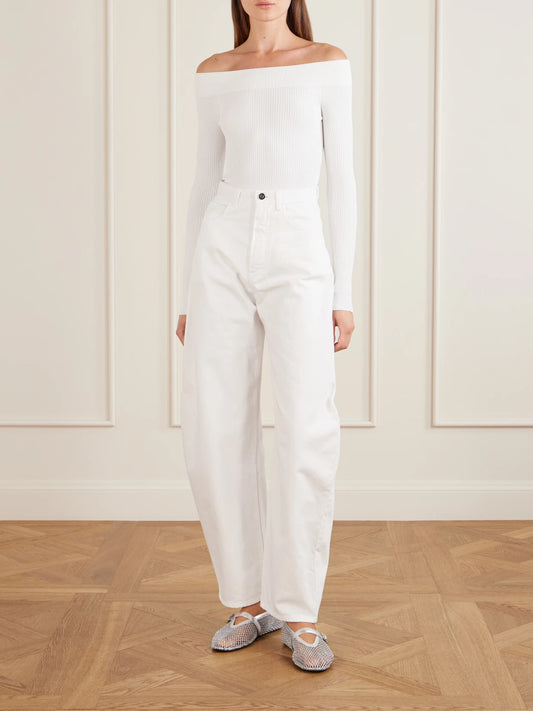 Image of a model wearing Tops. Product name - Off-the-shoulder Ribbed-knit Bodysuit in White colour by brand - Alaïa