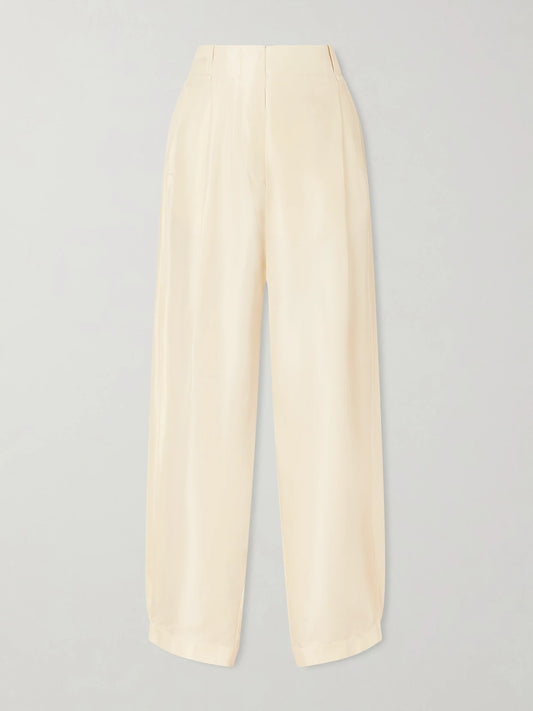 Image of a model wearing Pants. Product name - Kolina Pleated Silk-faille Wide-leg Pants in Pastel yellow colour by brand - The Row