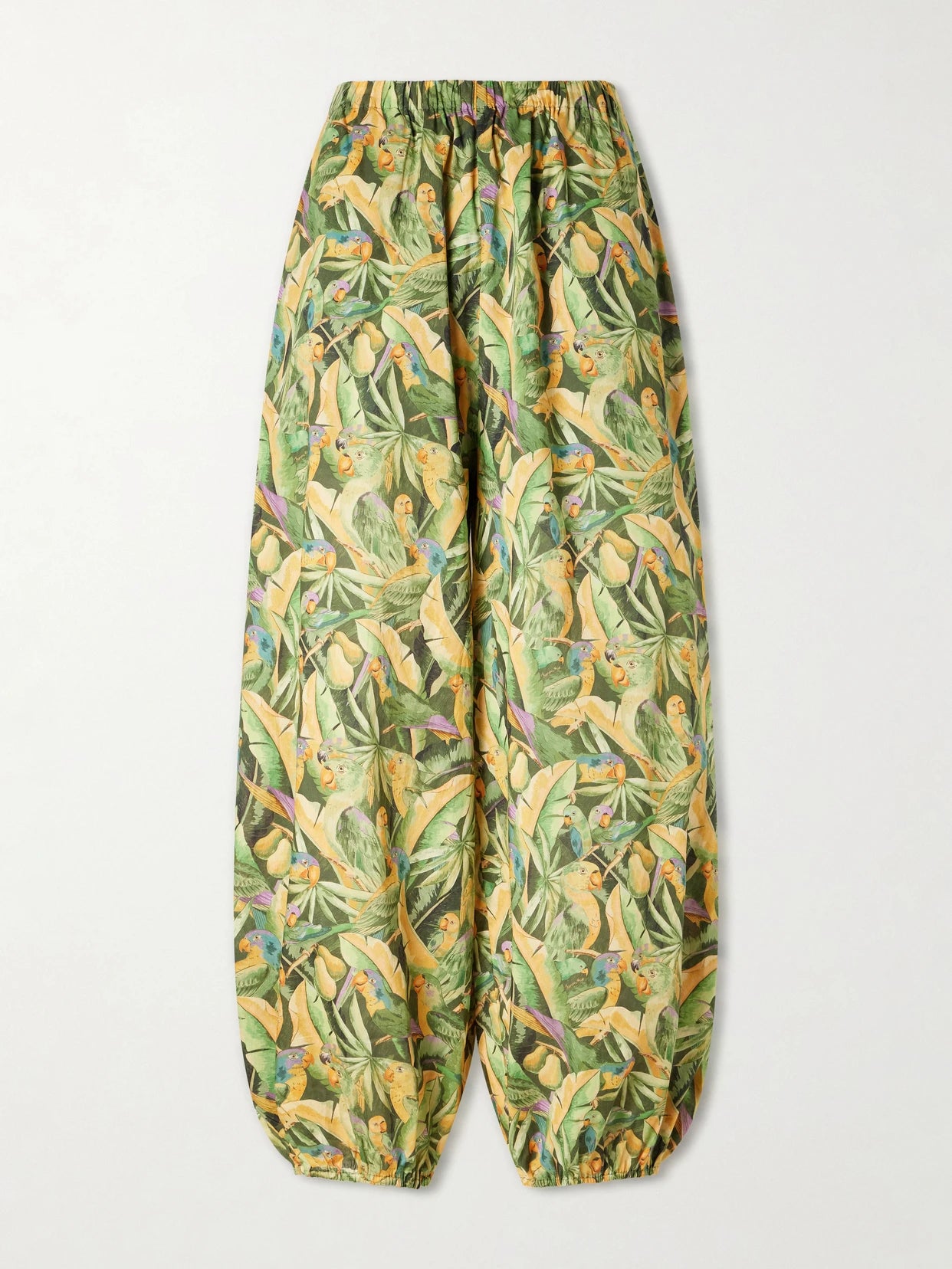 Image of a model wearing Pants. Product name - Parrot Printed Balloon Cotton Pants in Green colour by brand - Farm Rio