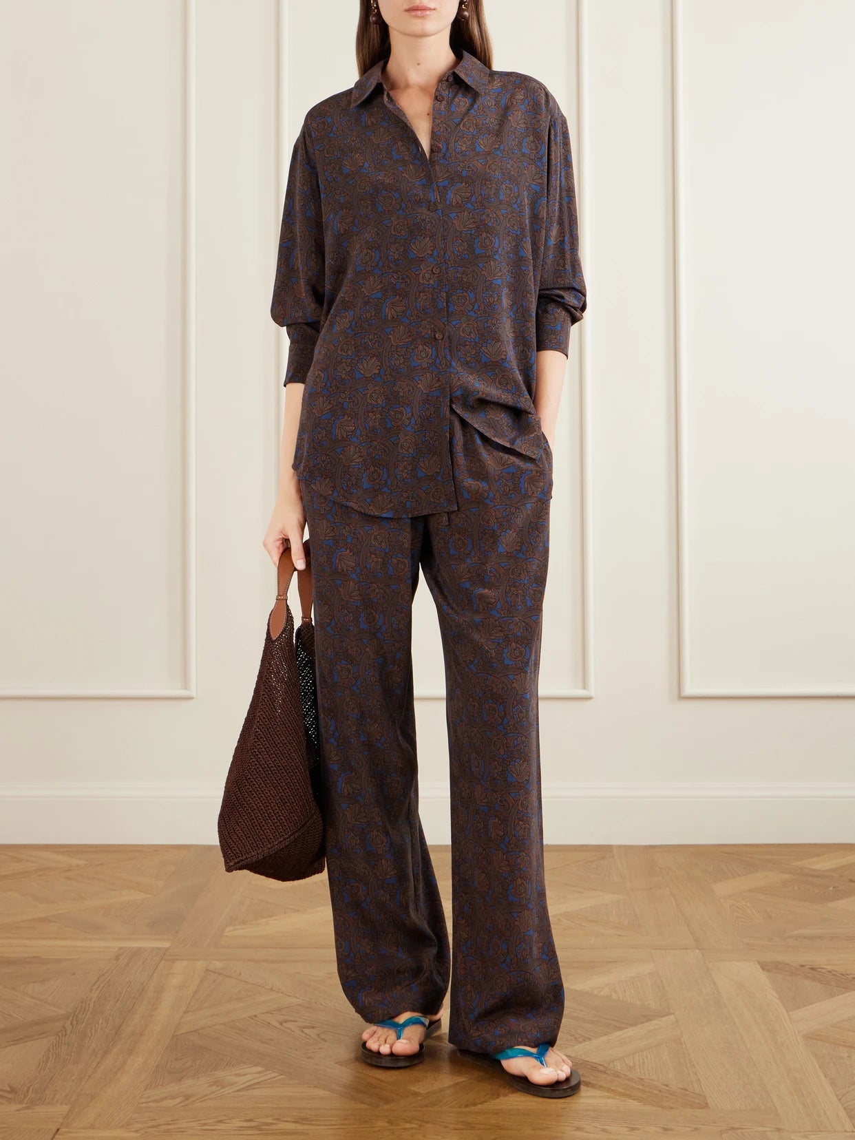 Image of a model wearing Pants. Product name - Printed Silk-crepe De Chine Straight-leg Pants in Brown colour by brand - Matteau