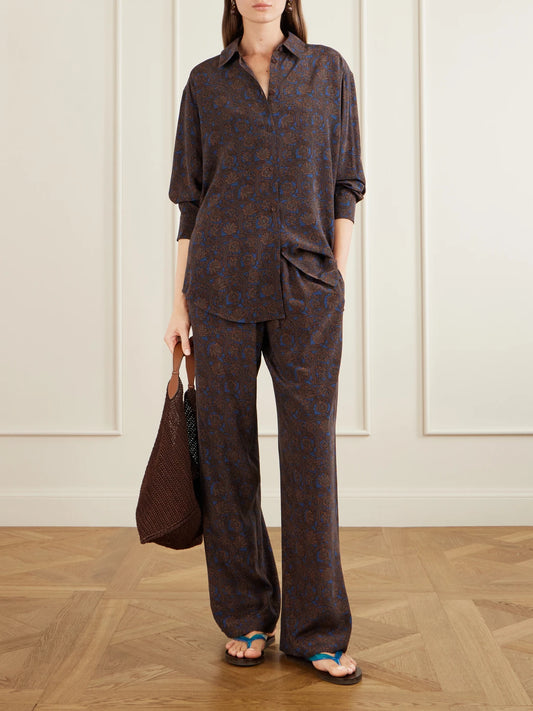 Image of a model wearing Pants. Product name - Printed Silk-crepe De Chine Straight-leg Pants in Brown colour by brand - Matteau