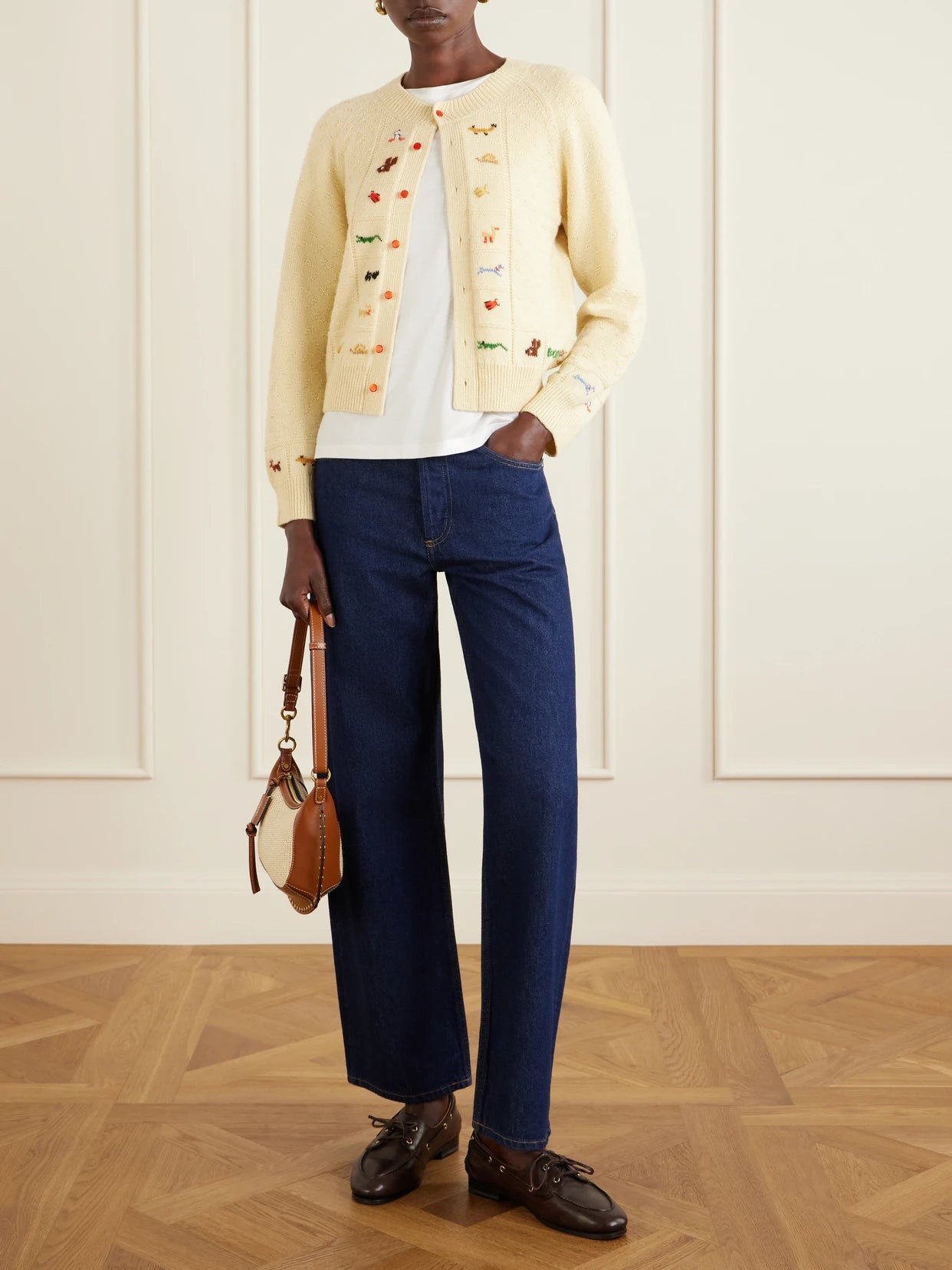 Image of a model wearing Outerwear. Product name - Zoologist Embroidered Merino Wool And Alpaca-blend Cardigan in Pastel yellow colour by brand - BODE