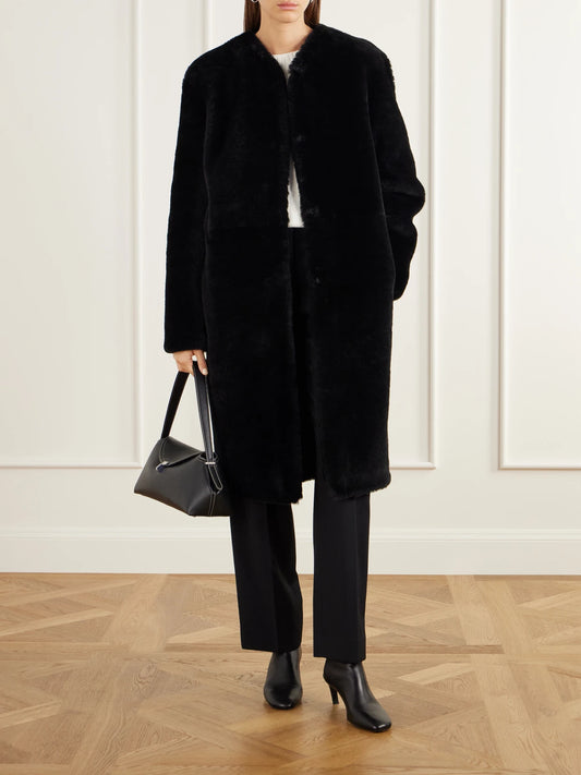 Image of Coats & Jackets. Product name - Collarless Shearling Coat in Black colour by brand - TOTEME