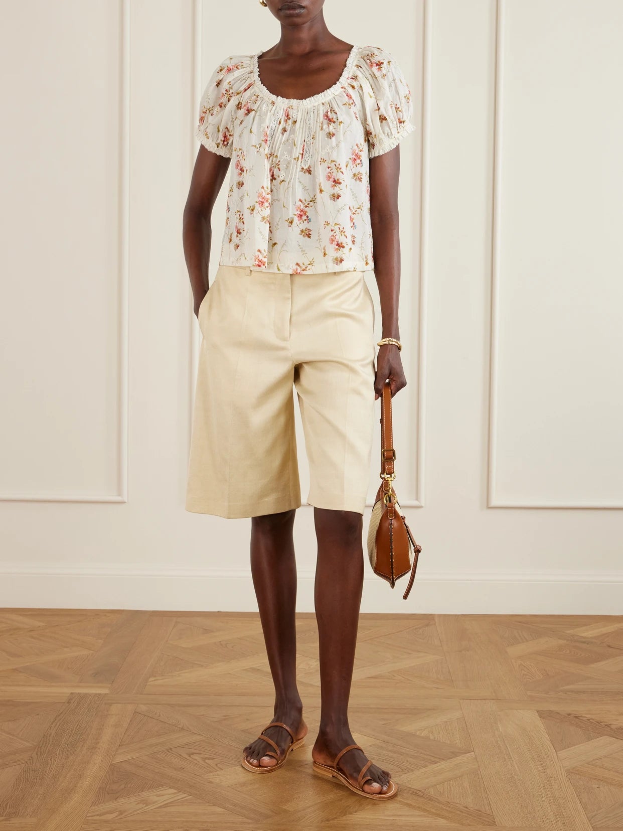 Image of a model wearing Tops. Product name - Frederica Lace-trimmed Floral-print Organic Cotton Blouse in Multi colour by brand - DÔEN