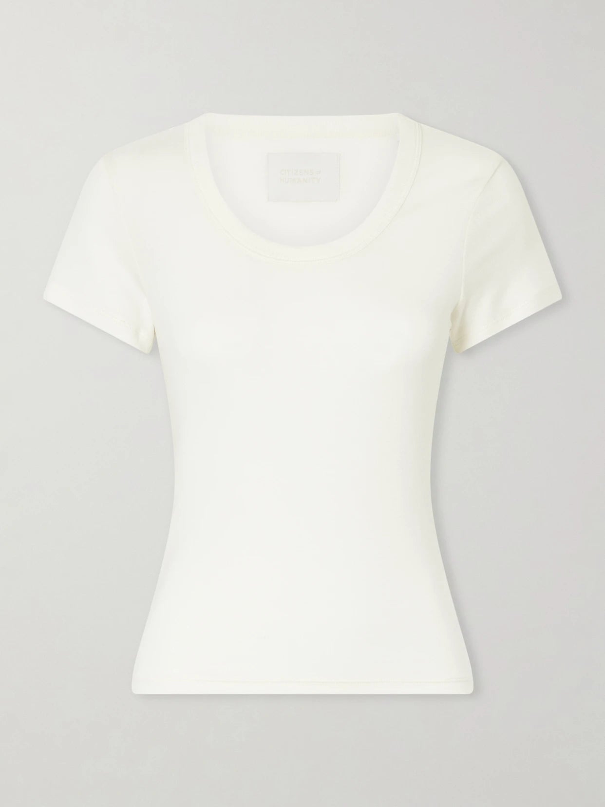 Image of a model wearing Tops. Product name - Maude Jersey T-shirt in Cream colour by brand - Citizens of Humanity