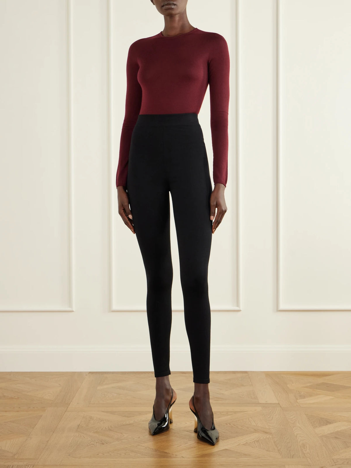 Image of a model wearing Tops. Product name - Wool-jersey Bodysuit in Burgundy colour by brand - Alaïa
