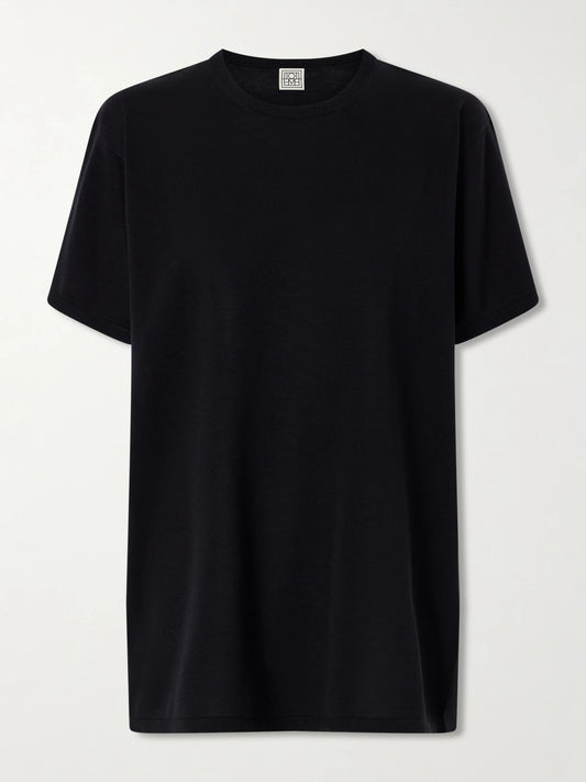 Image of a model wearing Tops. Product name - Lyocell And Cashmere-blend T-shirt in Black colour by brand - TOTEME