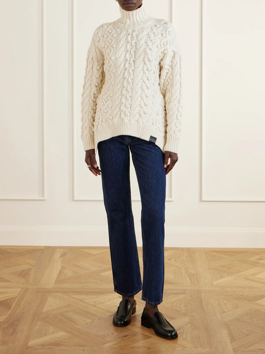 Image of a model wearing Outerwear. Product name - Bobble Cable-knit Wool Turtleneck Sweater in Ivory colour by brand - Stella McCartney