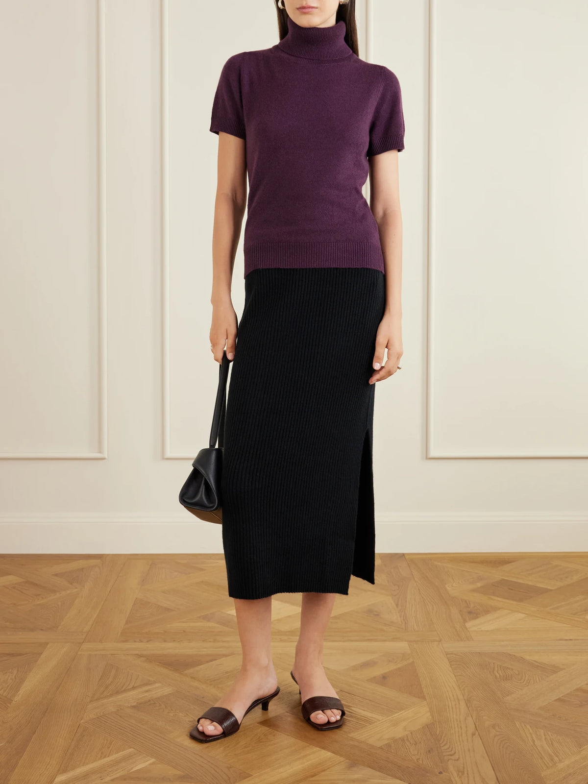 Image of a model wearing Skirts. Product name - Wool And Cashmere-blend Midi Skirt in Black colour by brand - Allude