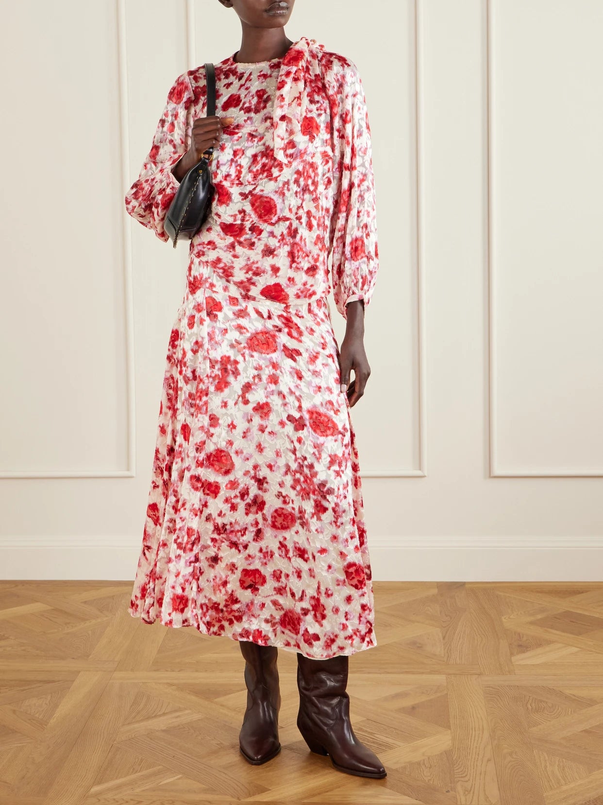 Image of a model wearing Skirts. Product name - Hilza Floral-print Chiffon Midi Skirt in Red colour by brand - ISABEL MARANT