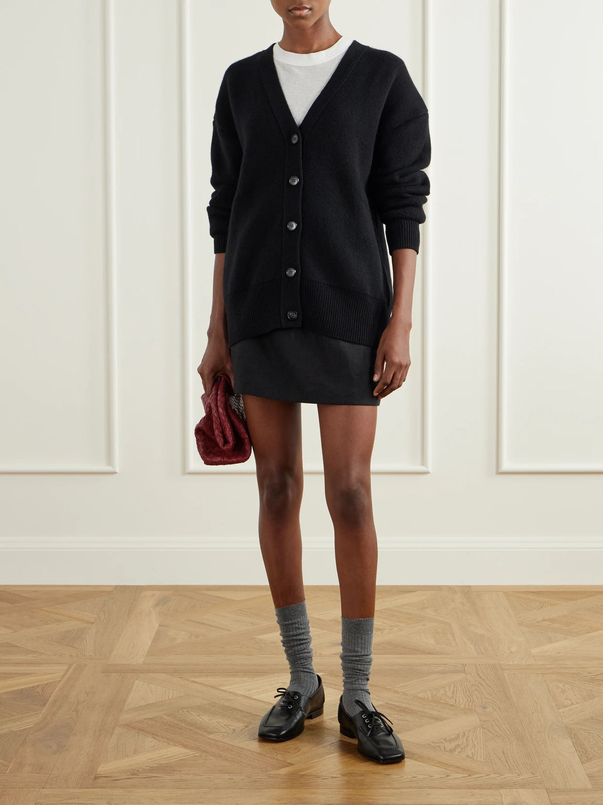 Image of a model wearing Outerwear. Product name - Amery Cashmere Cardigan in Black colour by brand - LISA YANG
