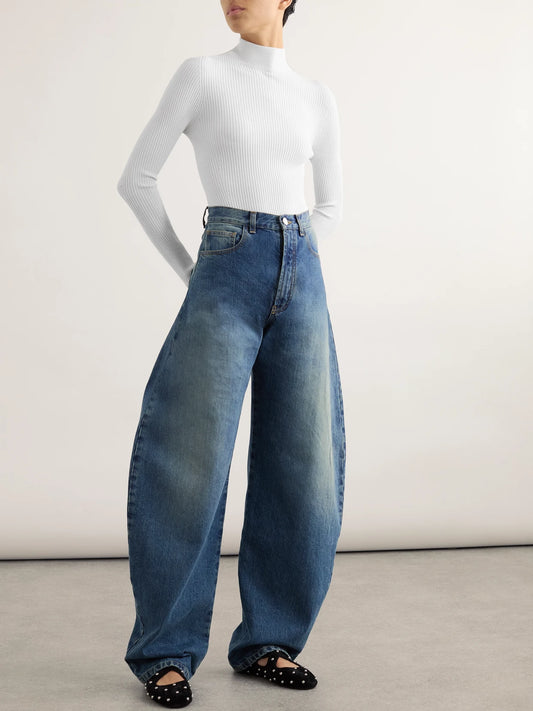 Image of a model wearing Tops. Product name - Ribbed-knit Turtleneck Bodysuit in White colour by brand - Alaïa