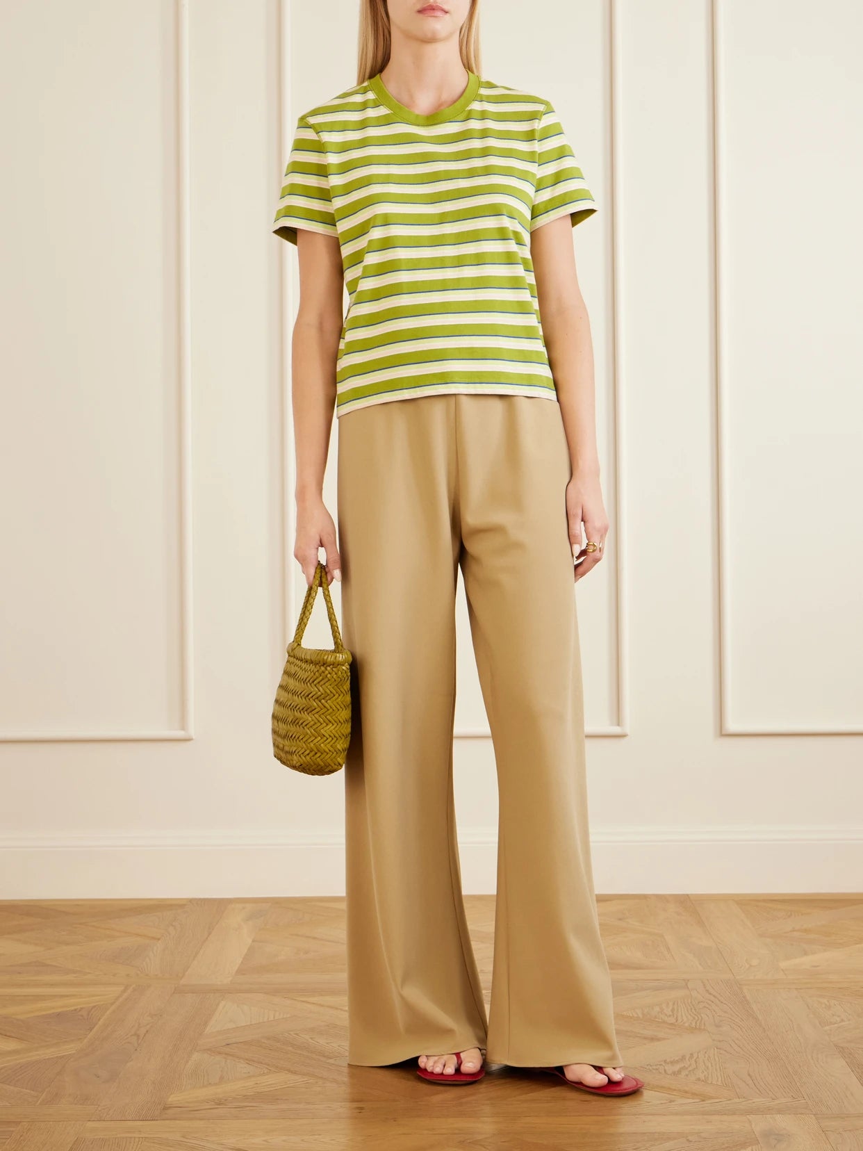 Image of a model wearing Tops. Product name - Mol Cropped Striped Cotton T-shirt in Green colour by brand - La Ligne