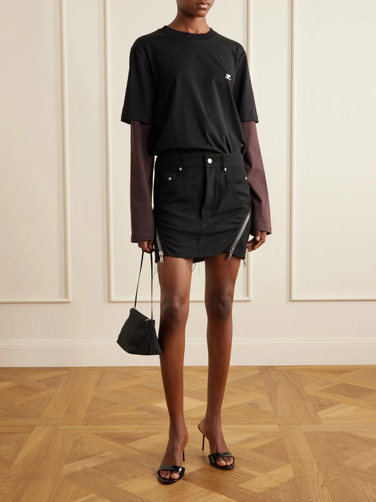 Image of a model wearing Tops. Product name - Logo-embroidered Cotton-jersey T-shirt in Black colour by brand - COURREGES