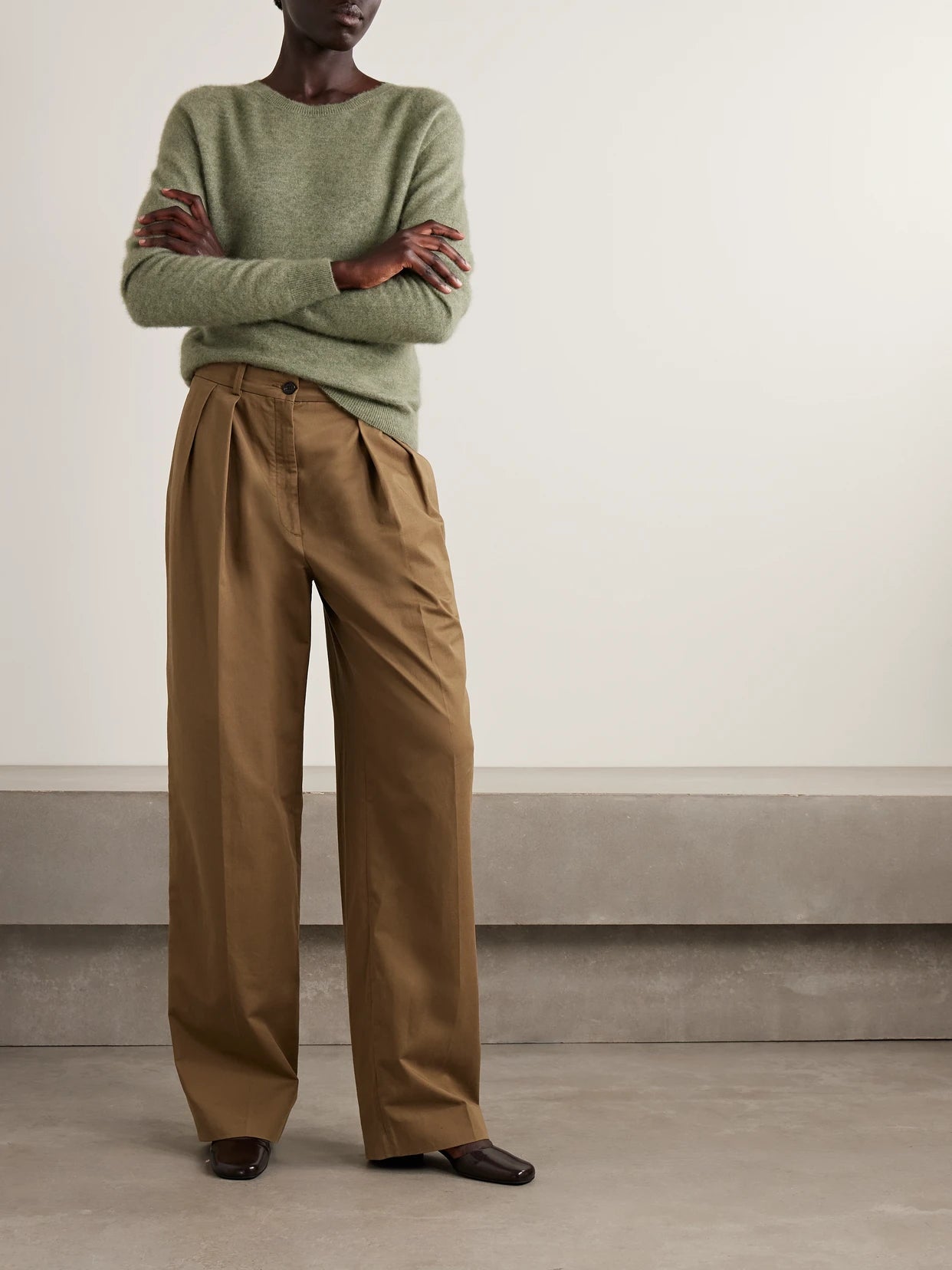 Image of a model wearing Pants. Product name - Igor Cotton And Cashmere-blend Gabardine Wide-leg Pants in Sand colour by brand - The Row