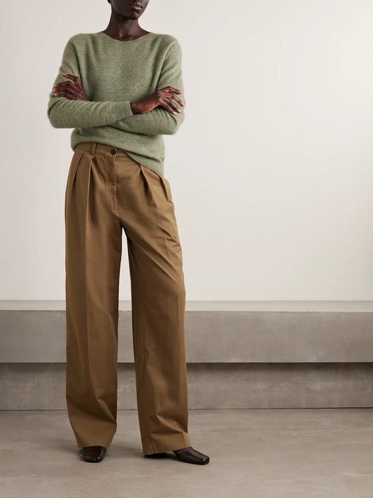 Image of a model wearing Pants. Product name - Igor Cotton And Cashmere-blend Gabardine Wide-leg Pants in Sand colour by brand - The Row