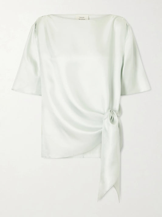 Image of a model wearing Tops. Product name - Mano Knotted Silk-twill Blouse in Light green colour by brand - Loulou de Saison