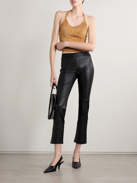 Image of a model wearing Pants. Product name - Jp Twenty Cropped Leather Flared Leggings in Black colour by brand - STOULS