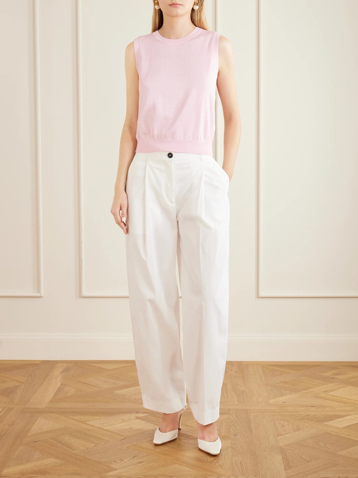 Image of a model wearing Outerwear. Product name - Ribbed Silk And Cotton-blend Vest in Pink colour by brand - Carolina Herrera