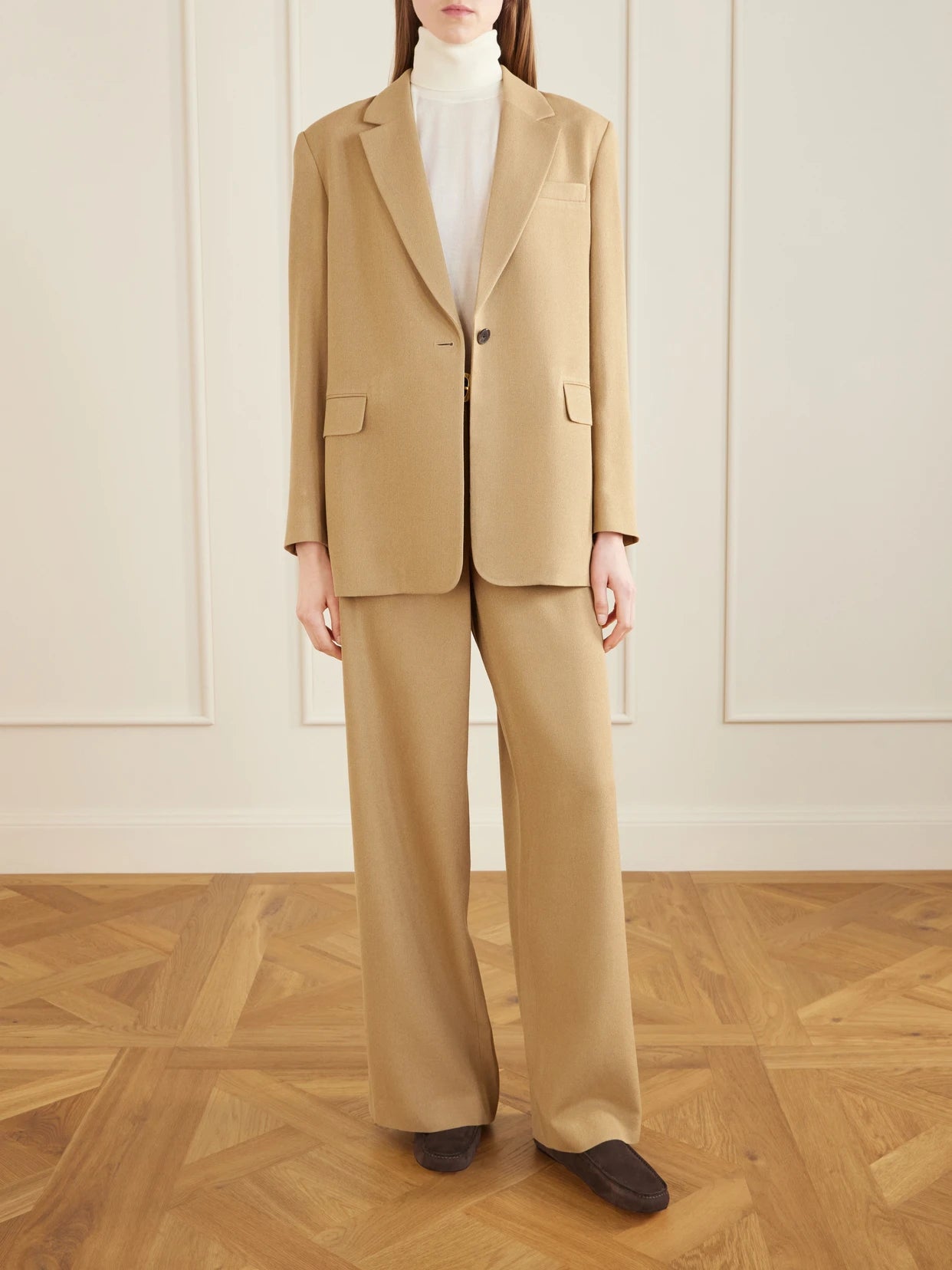Image of a model wearing Outerwear. Product name - Ezri Silk Blazer in Beige colour by brand - The Row