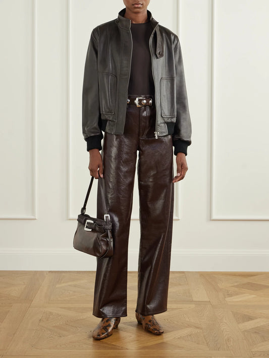 Image of a model wearing Pants. Product name - Arc Recycled Leather-blend Mid-rise Wide-leg Pants in Brown colour by brand - AGOLDE