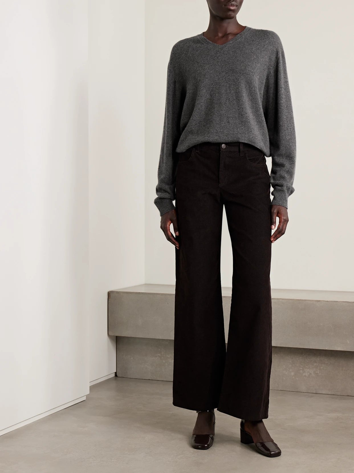 Image of a model wearing Outerwear. Product name - Ligeia Cashmere Sweater in Gray colour by brand - The Row