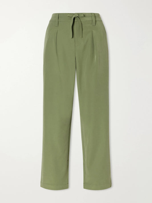 Image of a model wearing Pants. Product name - Hadleigh Twill Tapered Pants in Green colour by brand - Varley