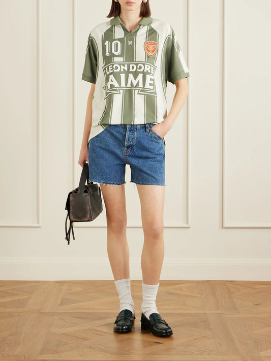 Image of a model wearing Tops. Product name - Logo-appliquéd Striped Jersey T-shirt in Green colour by brand - Aimé Leon Dore