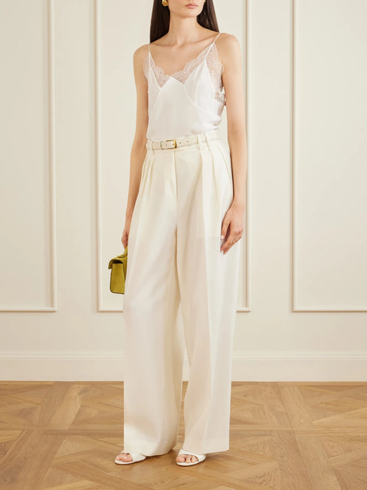 Image of a model wearing Tops. Product name - Capucines Scalloped Lace-trimmed Silk Crepe De Chine Camisole in White colour by brand - Sharon Wauchob