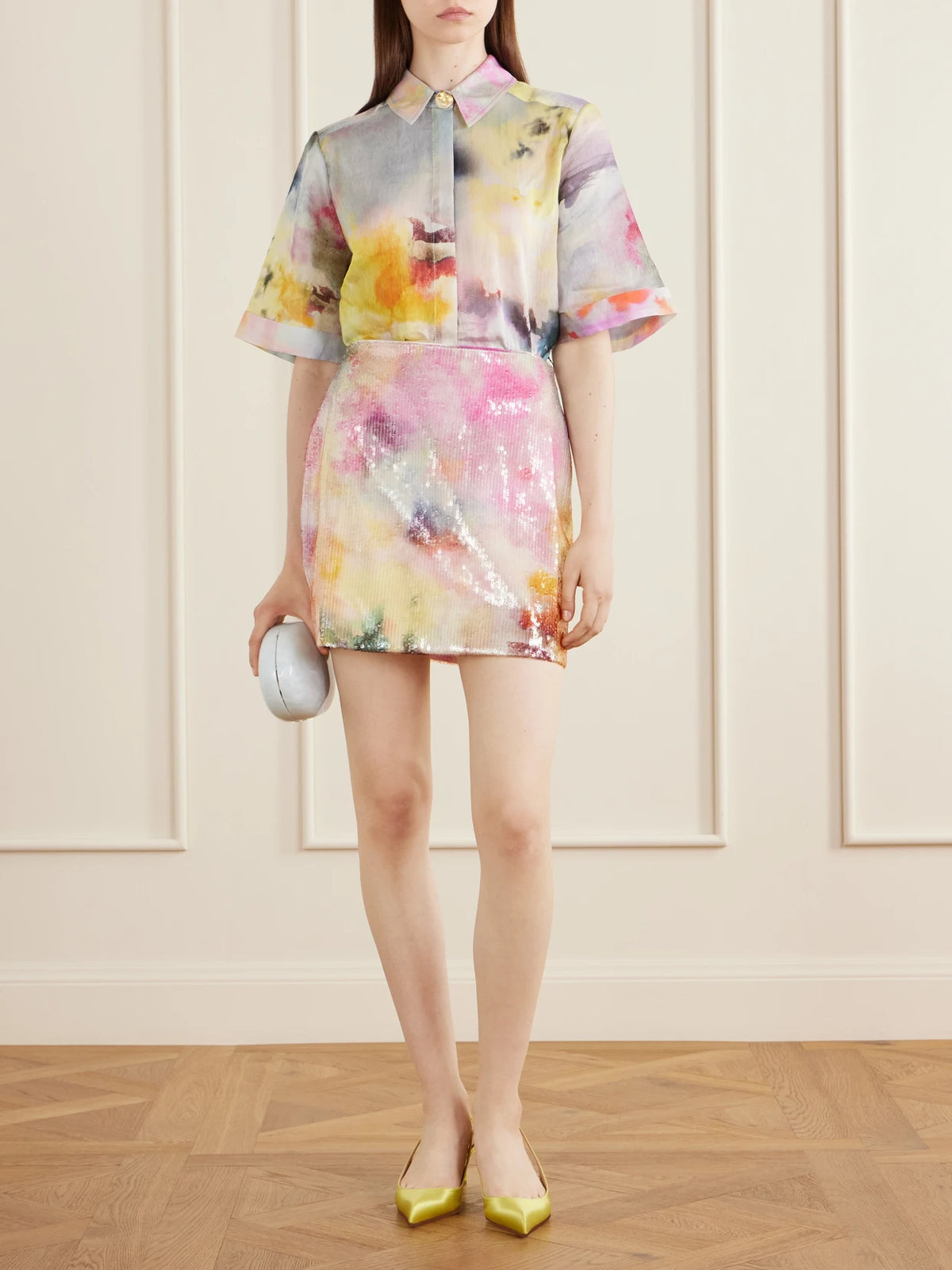 Image of a model wearing Skirts. Product name - Sybilla Sequined Mini Skirt in Pink colour by brand - Aje