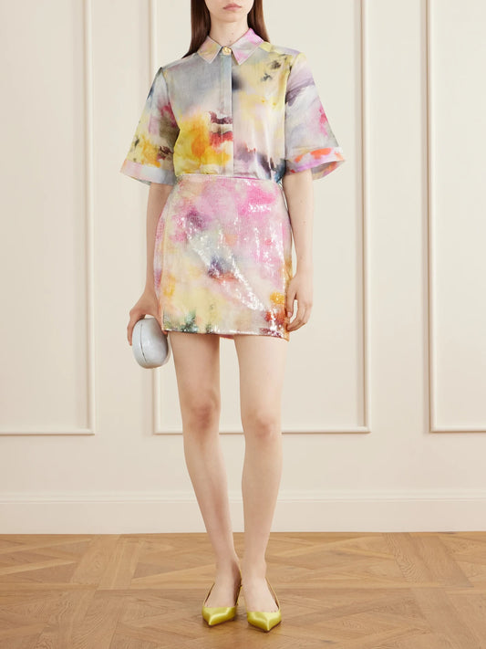 Image of a model wearing Skirts. Product name - Sybilla Sequined Mini Skirt in Pink colour by brand - Aje