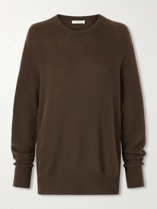 Image of a model wearing Outerwear. Product name - Odelle Cashmere Knit in Dark brown colour by brand - The Row