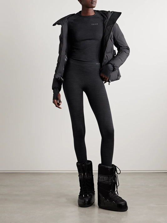 Image of a model wearing Tops. Product name - Wool-blend Top in Black colour by brand - FALKE Ergonomic Sport System
